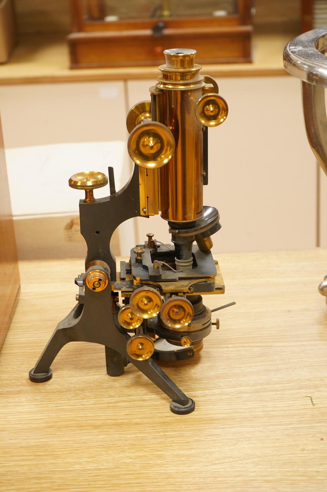 A early 20th century brass compound monocular microscope, by W. Watson and Sons, 313, High Holborn, London, number 9385, mahogany cased, with accessories including - four additional objectives, two eyepieces and a bull’s